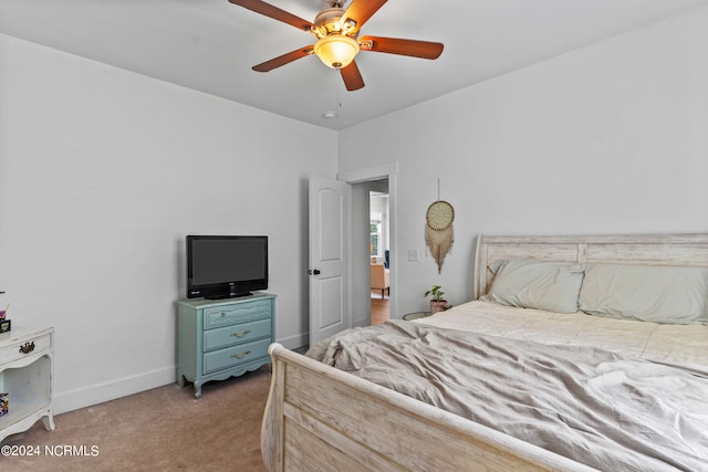 bedroom with light carpet and ceiling fan