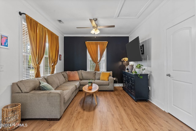 living room with light hardwood / wood-style flooring, ornamental molding, and ceiling fan