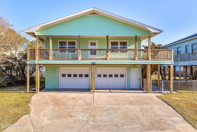 view of front of home featuring a garage and a porch