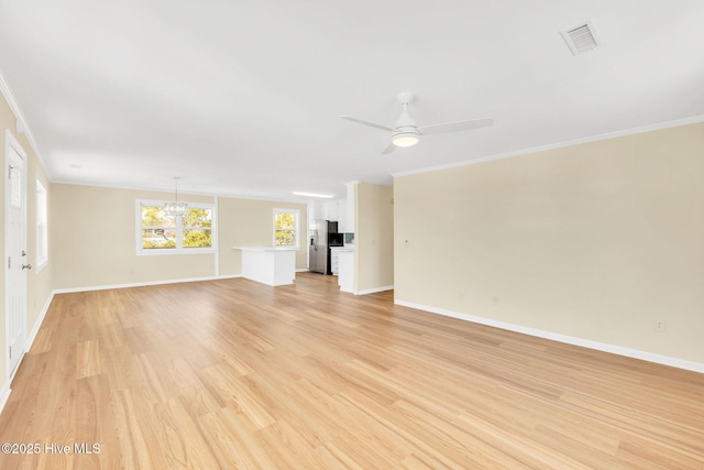 unfurnished living room featuring ornamental molding, ceiling fan with notable chandelier, and light hardwood / wood-style flooring