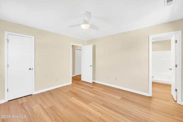 unfurnished bedroom with connected bathroom, light hardwood / wood-style flooring, and ceiling fan