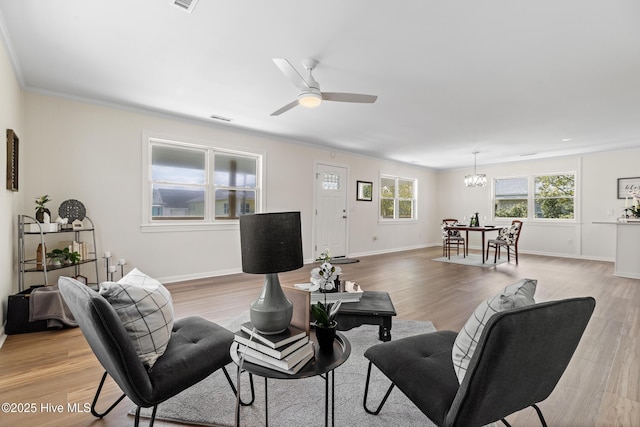 unfurnished bedroom with light wood-type flooring, baseboards, ensuite bath, a ceiling fan, and visible vents