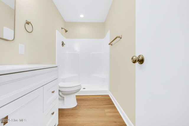 empty room featuring ceiling fan and light hardwood / wood-style flooring