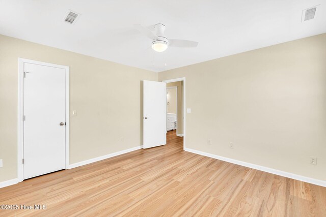 spare room with light hardwood / wood-style floors and ceiling fan