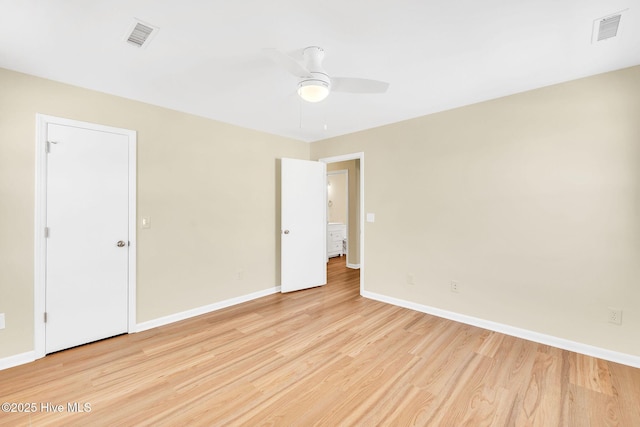 spare room featuring ceiling fan and light hardwood / wood-style floors