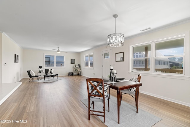 spare room featuring visible vents, baseboards, light wood-type flooring, and ceiling fan