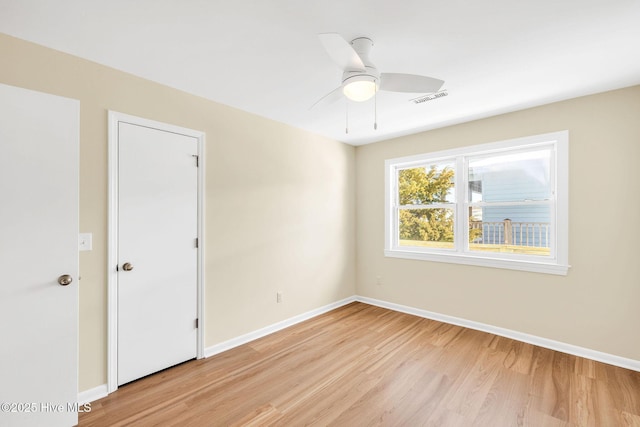 unfurnished room featuring light hardwood / wood-style floors and ceiling fan