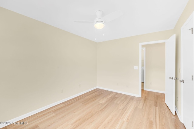 spare room with ceiling fan and light hardwood / wood-style flooring