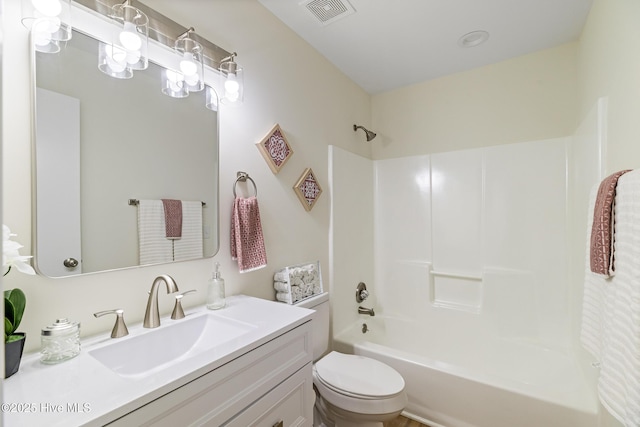 bathroom featuring visible vents, toilet, vanity, and bathing tub / shower combination