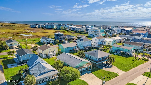 birds eye view of property with a water view and a residential view