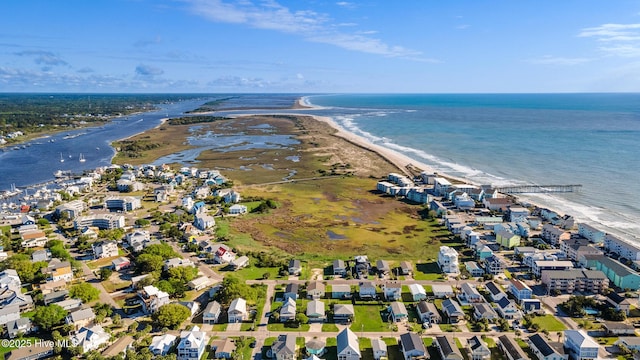 bird's eye view featuring a view of the beach, a residential view, and a water view