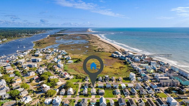 bird's eye view featuring a view of the beach, a residential view, and a water view