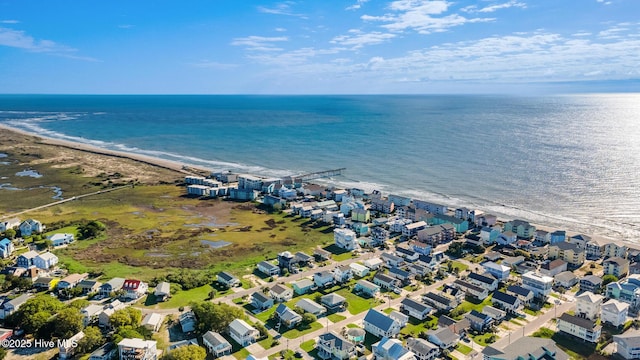 drone / aerial view with a water view and a residential view