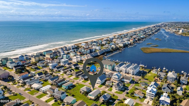 birds eye view of property featuring a water view and a residential view