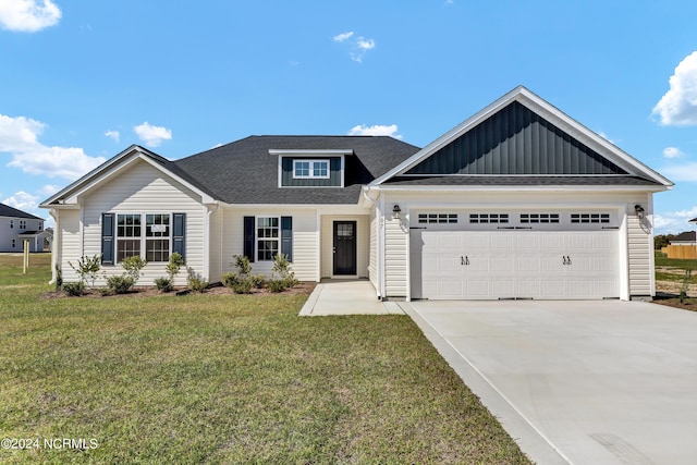 view of front facade featuring a garage and a front lawn