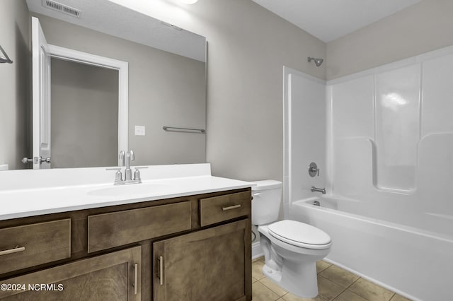 full bathroom featuring vanity, toilet, bathtub / shower combination, and tile patterned floors