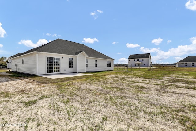 rear view of house featuring a patio