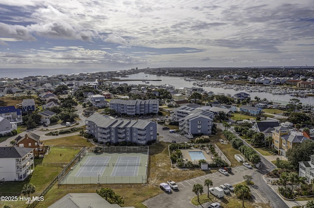 birds eye view of property with a water view