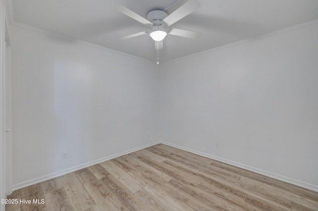 empty room with light wood-style floors, ceiling fan, baseboards, and crown molding