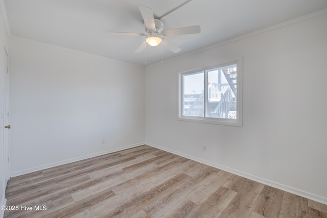 unfurnished room featuring crown molding, ceiling fan, baseboards, and light wood-style floors