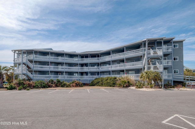 view of property with uncovered parking