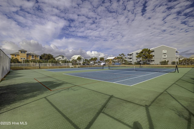 view of sport court with fence