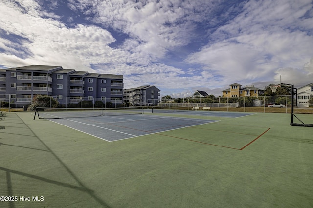 view of sport court with fence