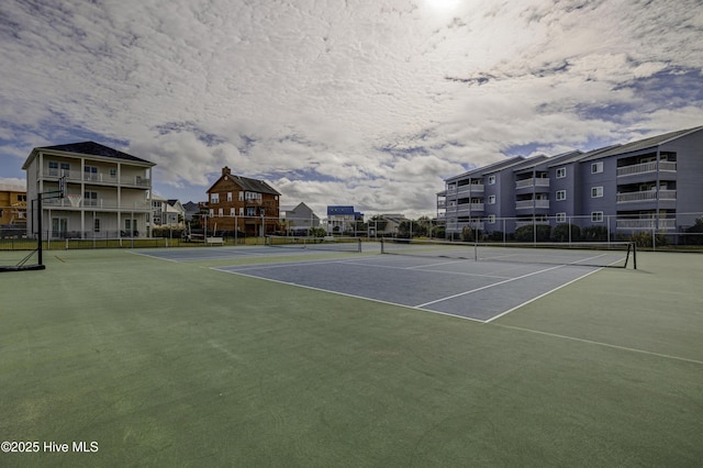 view of sport court with fence