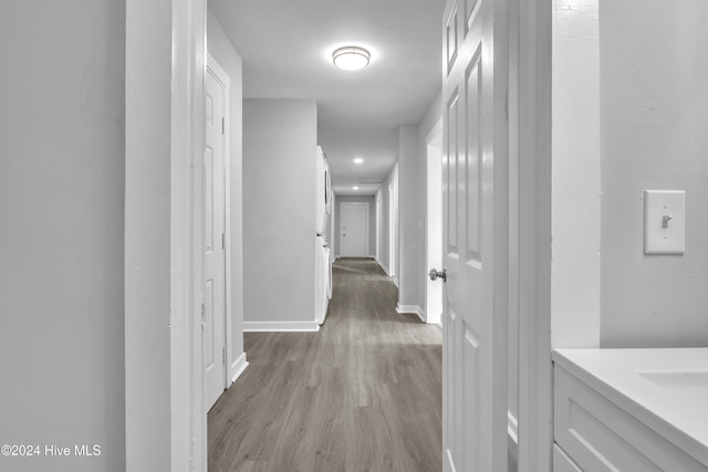 corridor featuring light hardwood / wood-style floors