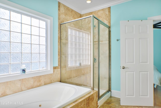 bathroom with crown molding and separate shower and tub