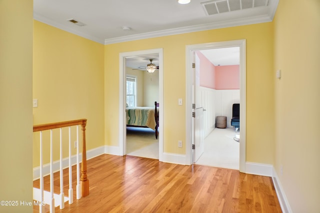 hall featuring crown molding and wood-type flooring