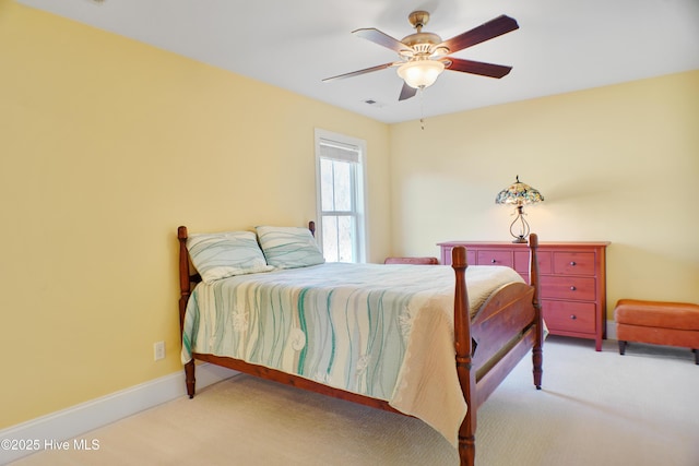 bedroom featuring ceiling fan and light colored carpet