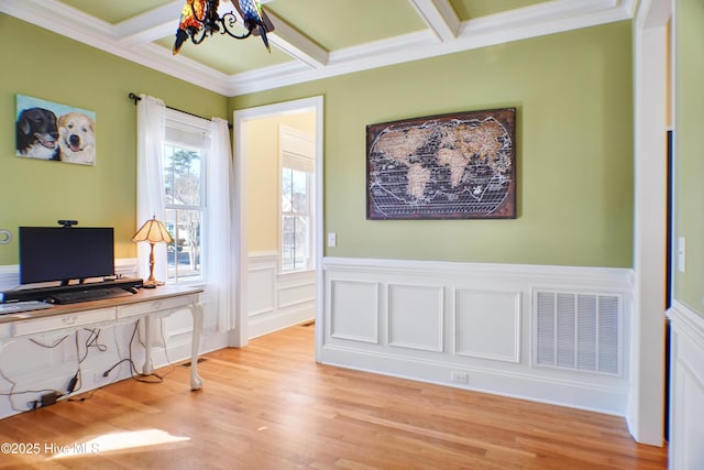 office with light hardwood / wood-style flooring, coffered ceiling, beamed ceiling, and crown molding