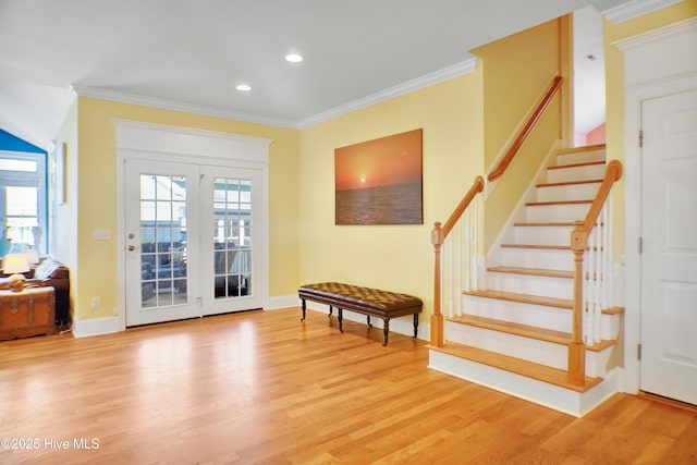 doorway to outside featuring light hardwood / wood-style flooring and ornamental molding