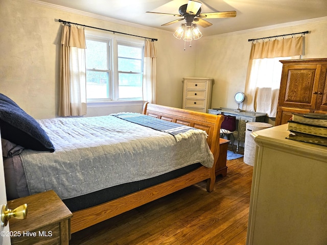 bedroom with ceiling fan, crown molding, and dark hardwood / wood-style flooring