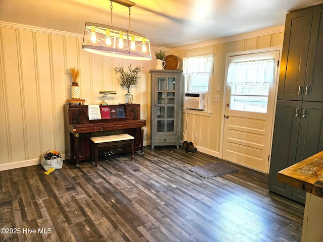 misc room with crown molding, dark wood-type flooring, and cooling unit