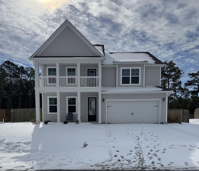 view of front of house featuring a garage and a balcony