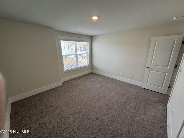 spare room with carpet floors