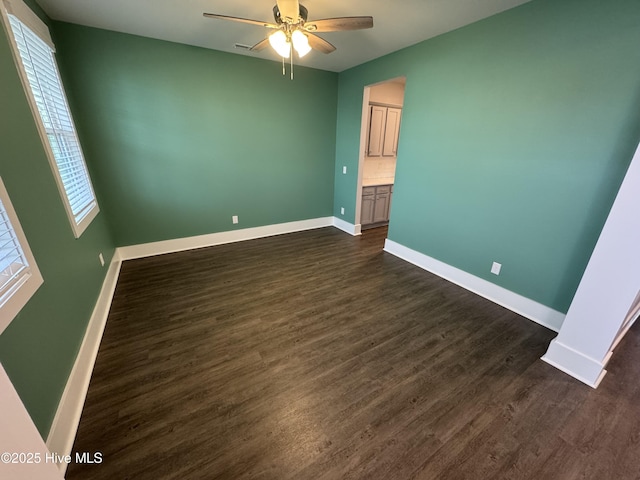 unfurnished bedroom featuring dark hardwood / wood-style floors and ceiling fan