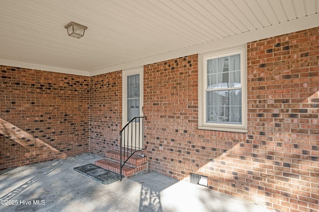 entrance to property featuring a patio area