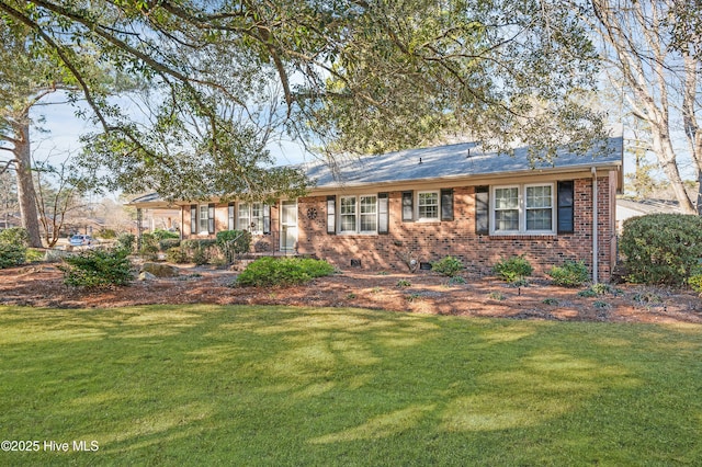 ranch-style house featuring a front lawn