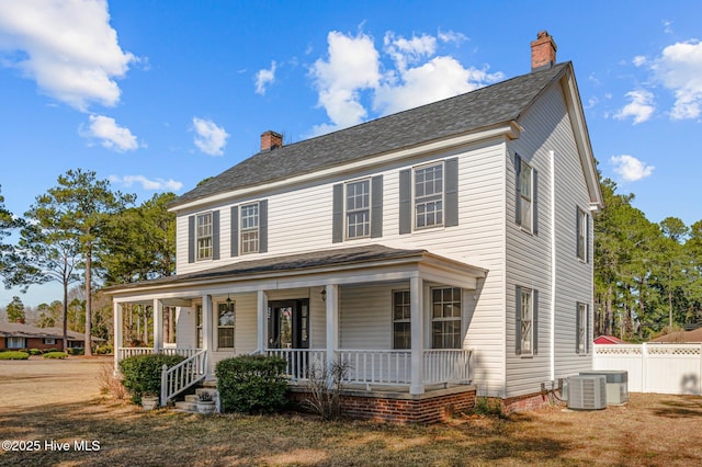 view of front of home with covered porch and central air condition unit