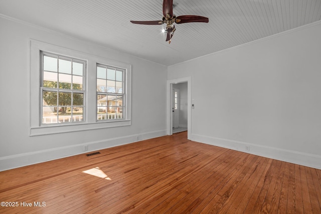 unfurnished room with ceiling fan, ornamental molding, and wood-type flooring