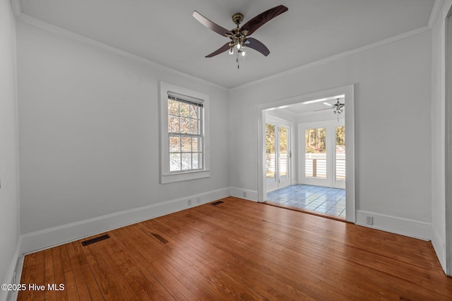 unfurnished room featuring crown molding, light hardwood / wood-style floors, and ceiling fan