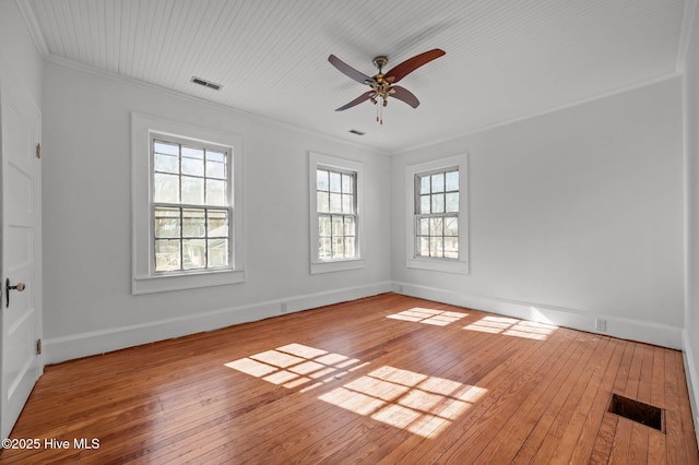 unfurnished room with light hardwood / wood-style flooring, ornamental molding, and ceiling fan