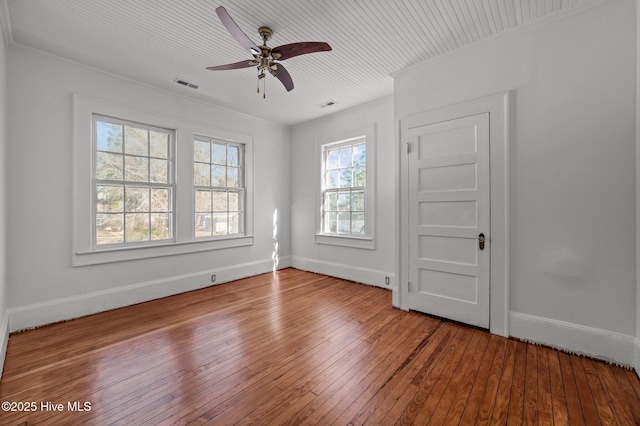 spare room featuring crown molding, ceiling fan, and wood-type flooring