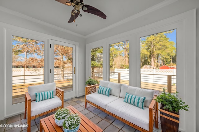 sunroom / solarium with ceiling fan and a healthy amount of sunlight