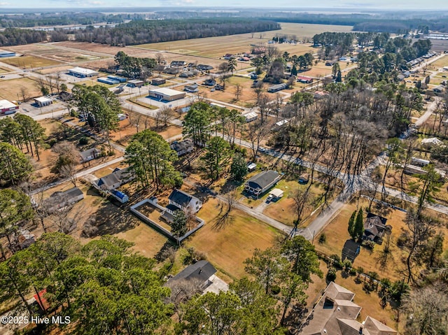 birds eye view of property with a rural view