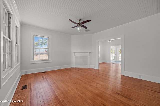 unfurnished living room with ornamental molding, a healthy amount of sunlight, ceiling fan, and light hardwood / wood-style flooring