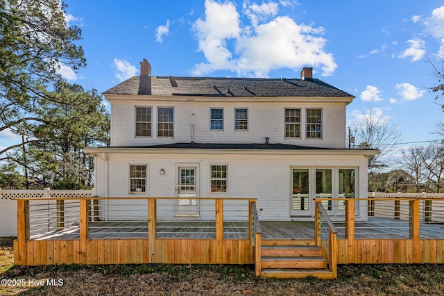 back of property featuring a deck